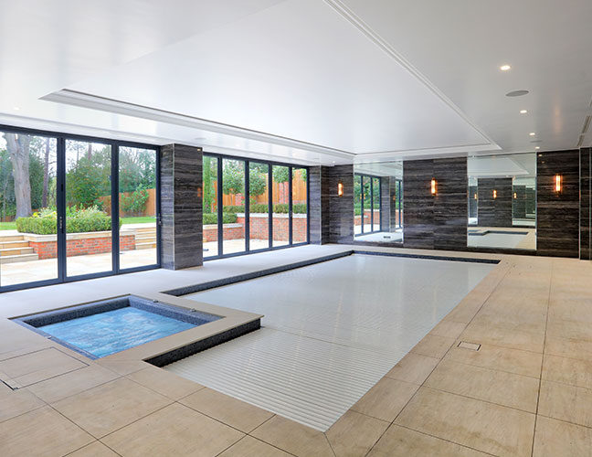 Falcon Pools indoor pool with fully closed Rolldeck cover