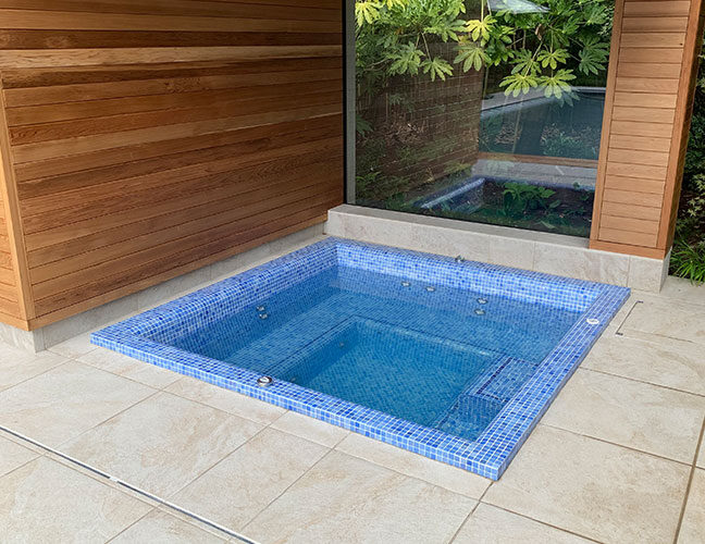 Falcon Pools inground pool spa with LED underwater lighting