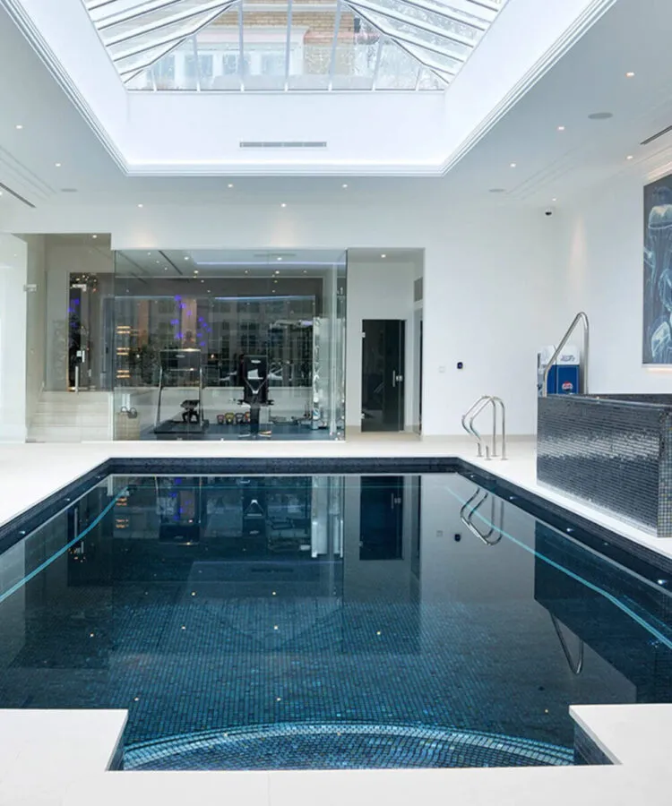 Luxury indoor pool with Metal mosaic pool finishing in Lava