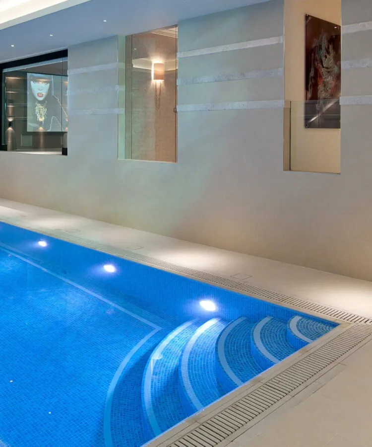 A luxury indoor Falcon Pool with classic tiled corner steps and gentle slopped bottom